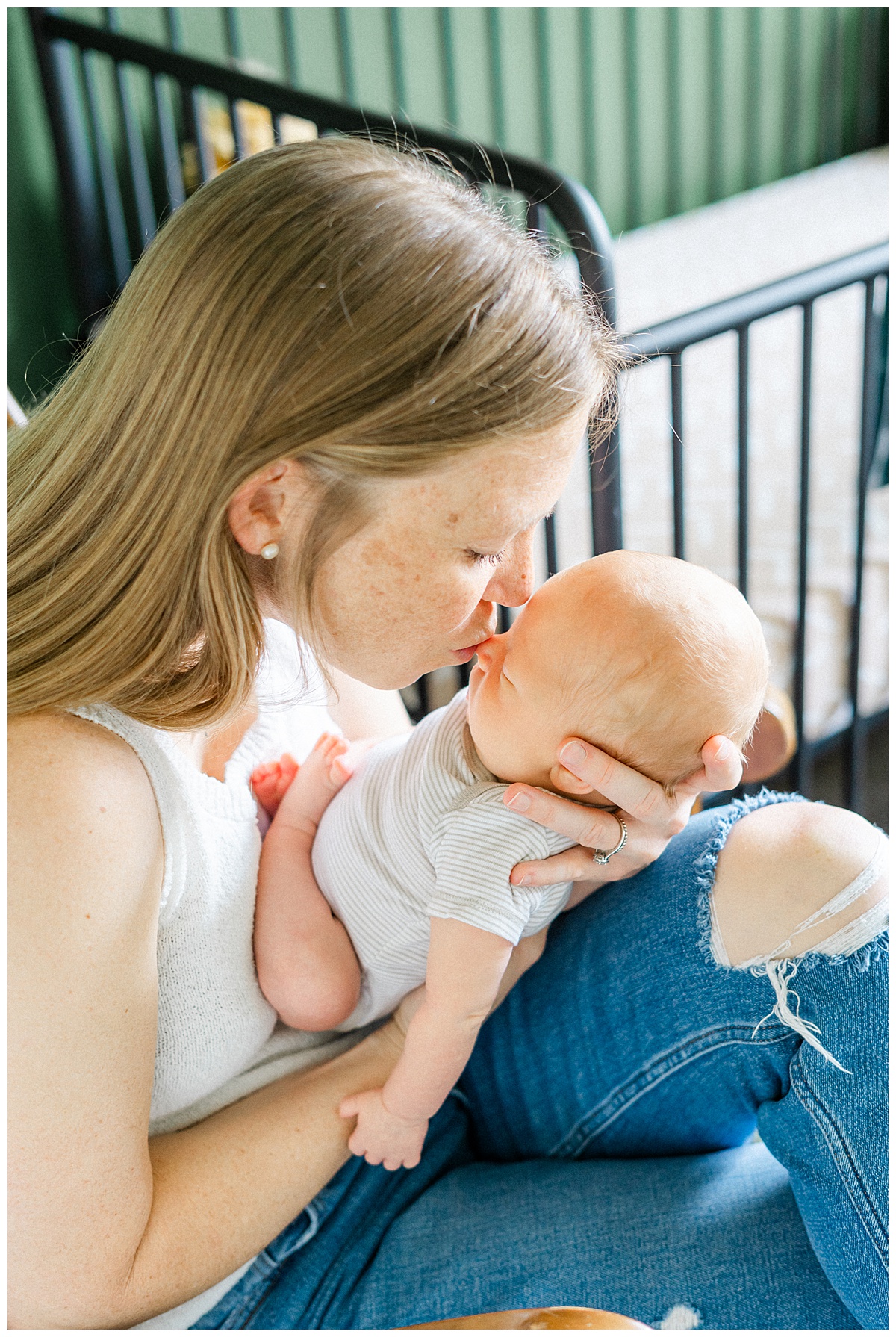 A mother kisses her baby on the nose during their session in their Georgetown, TX home.
