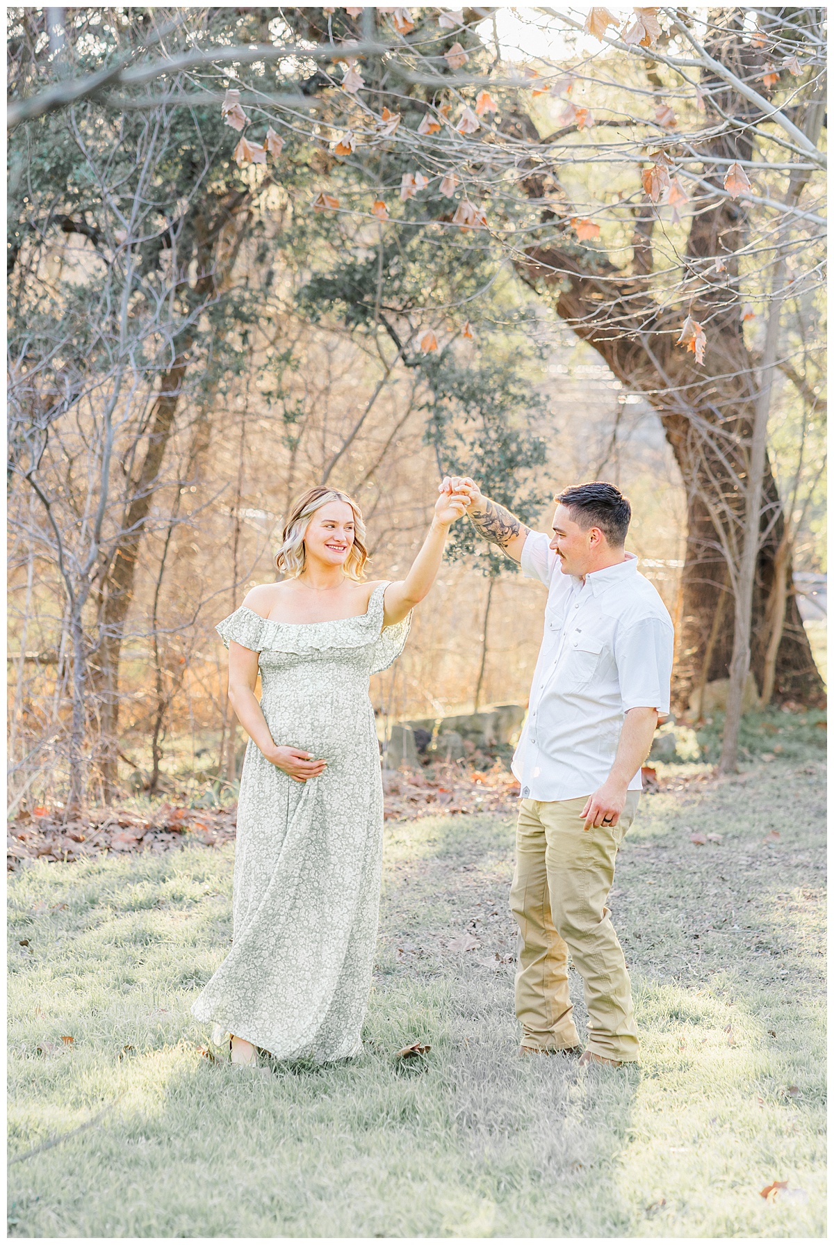 A couple dances at Bull Creek District Park in Austin, TX. The woman, dressed in a long green dress, is pregnant.